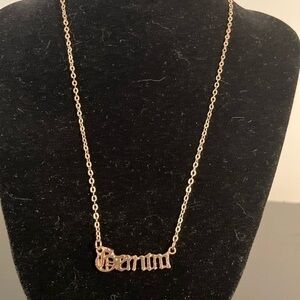 Golden necklace with “Gemini” pendant
